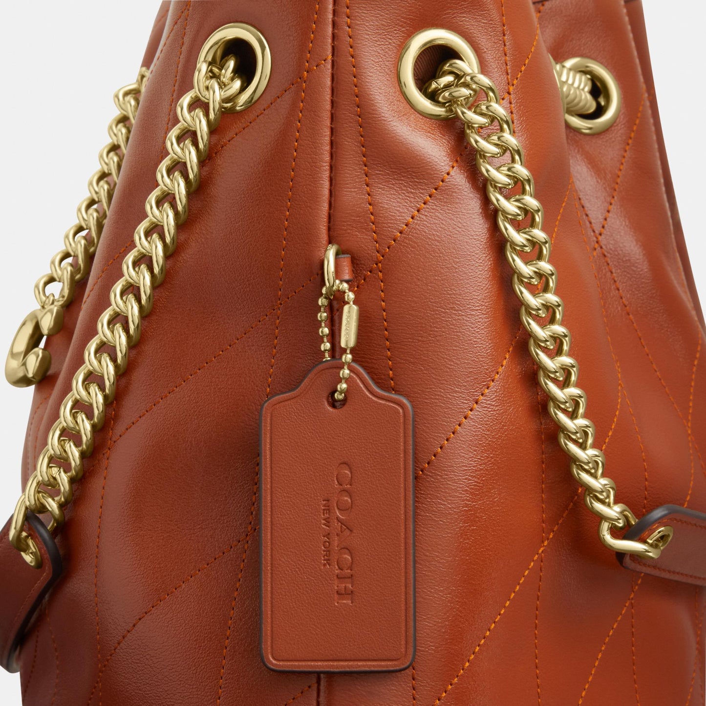 CES33-Evelyn Shoulder Bag with Quilting and Charm-Im/Cinnamon