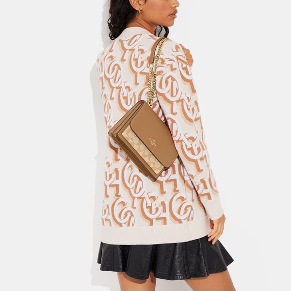 حقيبة "كلير Klare" كروس بودي من القماش الذي يحمل نقشة ماركة كوتش