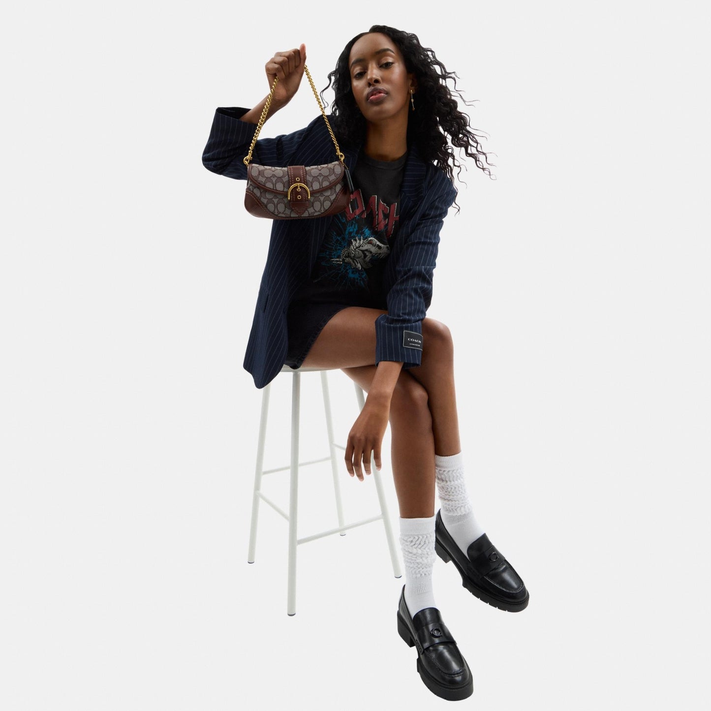 حقيبة "سوهو 25" من الجاكار بنقشة كوتش 