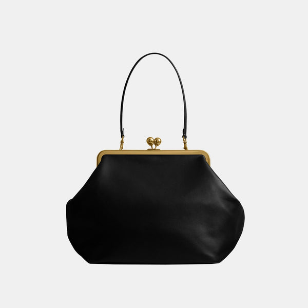 حقيبة كبيرة بإطار معدني وقفل متعاكس