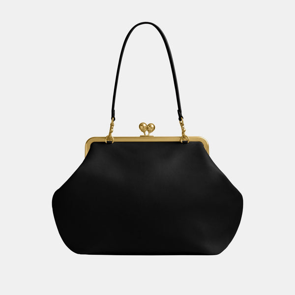 حقيبة كبيرة بإطار معدني وقفل متعاكس