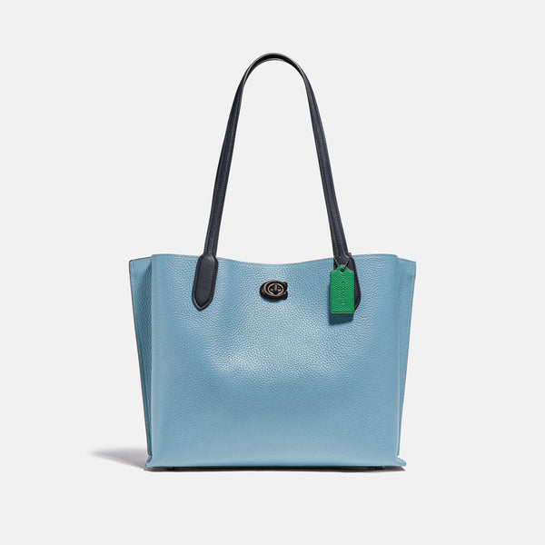 حقيبة "ويلو توت Willow Tote" بألوان مُغايرة و مبطنة بقماش يحمل نقشة ماركة كوتش