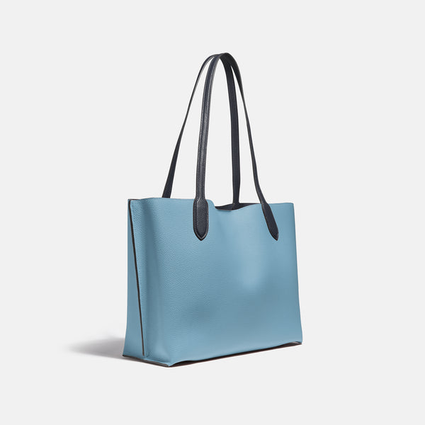 حقيبة "ويلو توت Willow Tote" بألوان مُغايرة و مبطنة بقماش يحمل نقشة ماركة كوتش