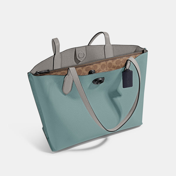 حقيبة "ويلو توت Willow Tote" بألوان مُغايرة و مبطنة بقماش يحمل نقشة ماركة كوتش