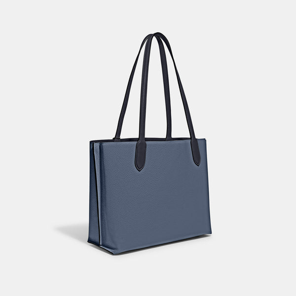 حقيبة "ويلو توت Willow Tote" بألوان مُغايرة و مبطنة بقماش يحمل نقشة ماركة كوتش