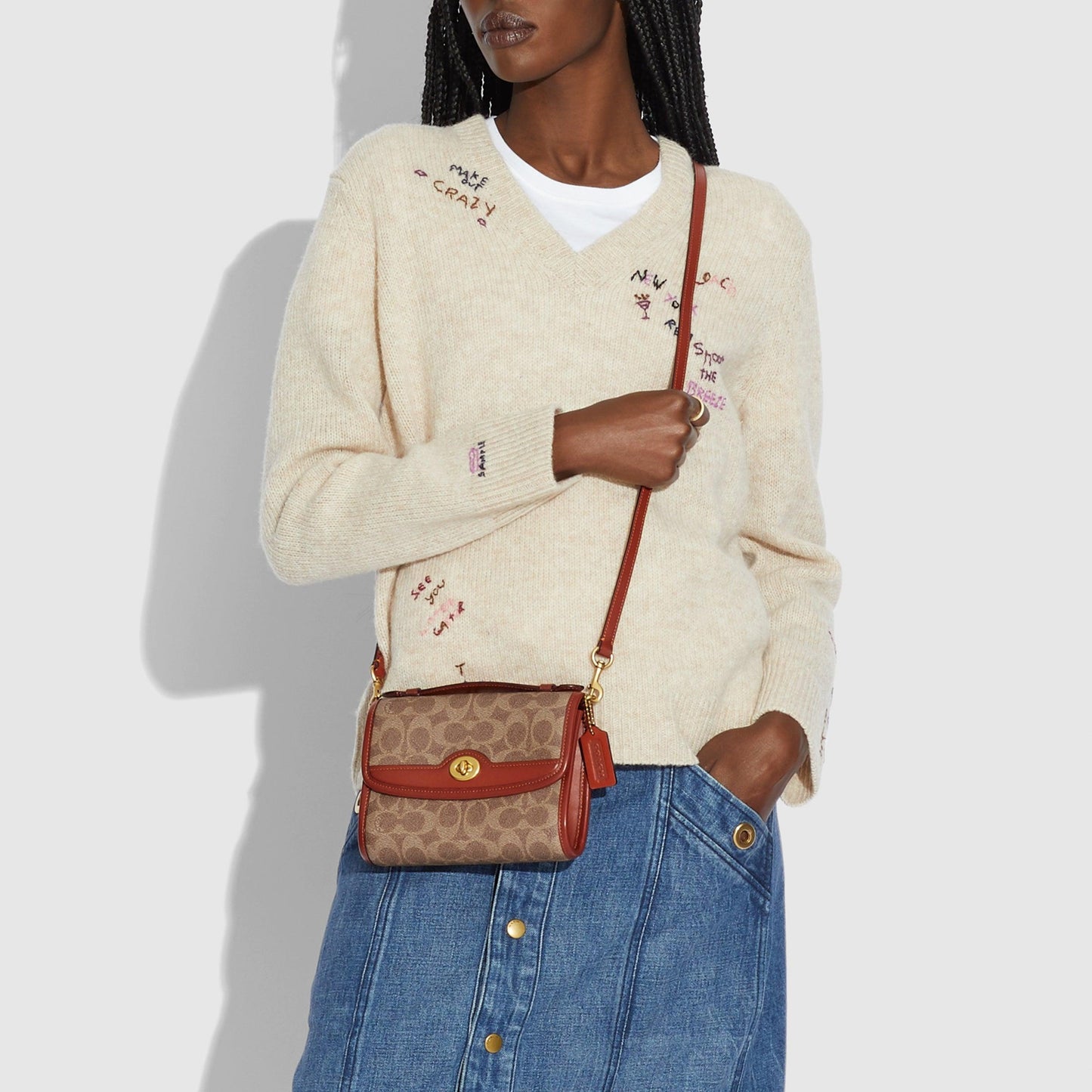 Kip Turnlock Crossbody In Signature Canvas - COACH Saudi Arabia Official Site