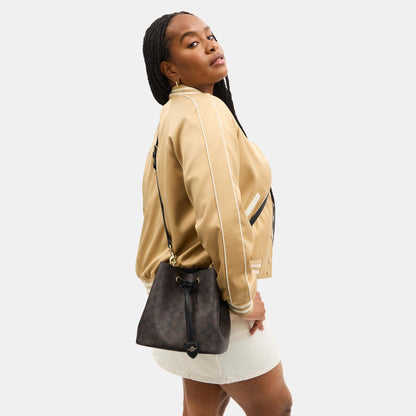 CBH07-Rowan Bucket Bag in Signature Canvas-Im/Walnut/Black