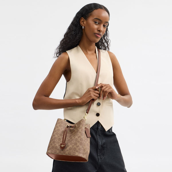 Rowan Bucket Bag In Signature Canvas