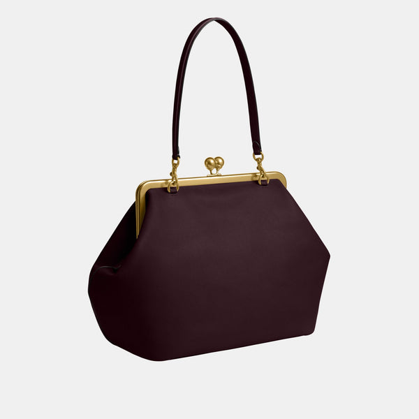 حقيبة كبيرة بإطار معدني وقفل متعاكس