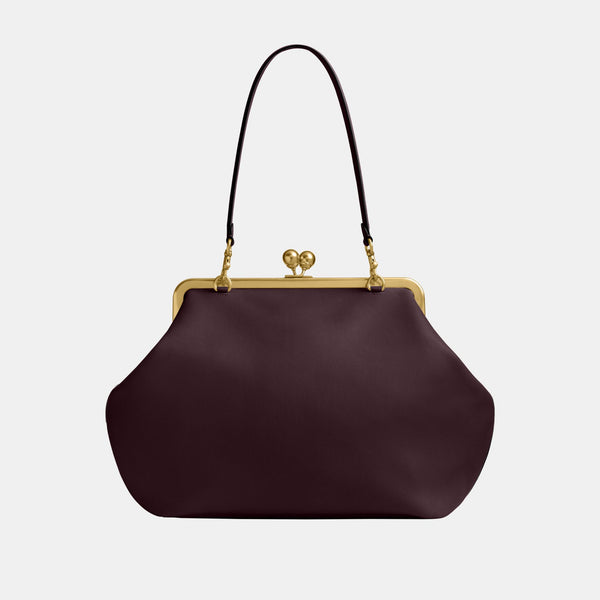 حقيبة كبيرة بإطار معدني وقفل متعاكس