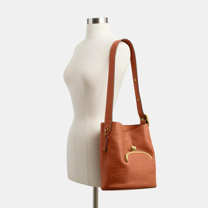 CDZ18-The Coach Originals Textured Pebble Leather Bleecker Bucket Bag with Kisslock-B4/Amber Brown