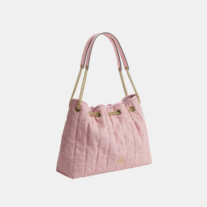 CER79-Evelyn Shoulder Bag in Loved Denim with Quilting and Charm-Im/Light Pink