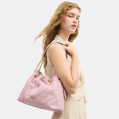 CER79-Evelyn Shoulder Bag in Loved Denim with Quilting and Charm-Im/Light Pink