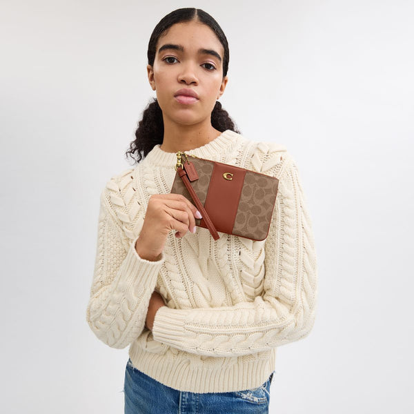 Small Wristlet In Signature Canvas
