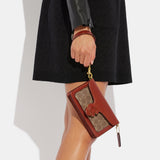 CK025-Tabby Wristlet In Signature Canvas