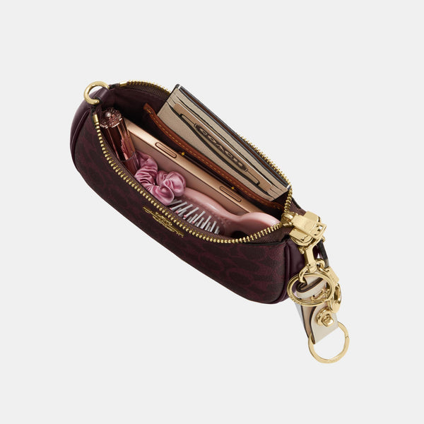 Teri Mini Crossbody Bag in Signature Canvas