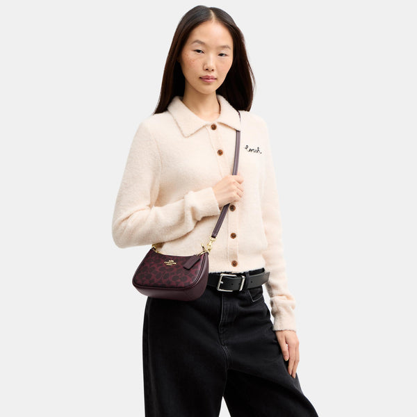 Teri Mini Crossbody Bag in Signature Canvas