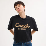 CX311-New Year Coach Snake Script Cropped T-Shirt In Organic Cotton-Black