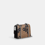 CY649-Klare Crossbody Bag In Signature Canvas With Bow Print-Sv/Tan/Black Multi