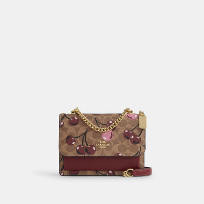 CY716-Mini Klare Crossbody Bag In Signature Canvas With Cherry Print-IM/Tan Multi