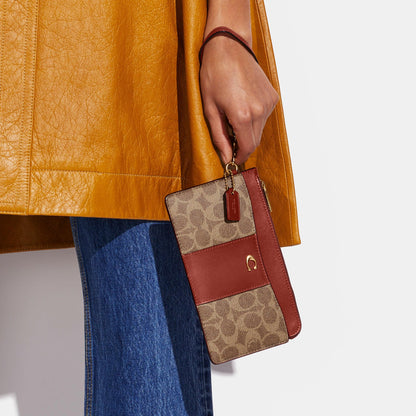 L-Zip Wristlet In Signature Canvas - COACH Saudi Arabia Official Site