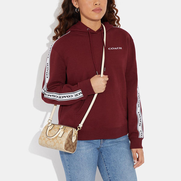 حقيبة "روان ساتشل Rowan Satchel" بحجم صغير من القماش بنقشة ماركة كوتش المقسم بالألوان